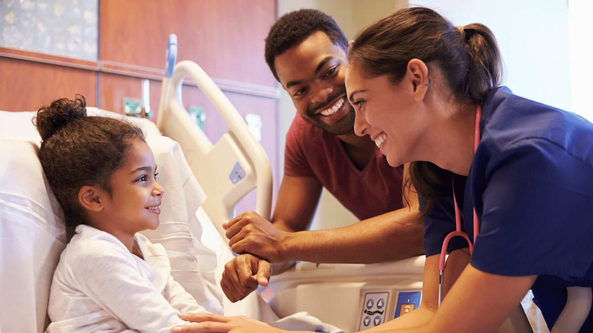 Nurses man and women are speaking with a little patient
