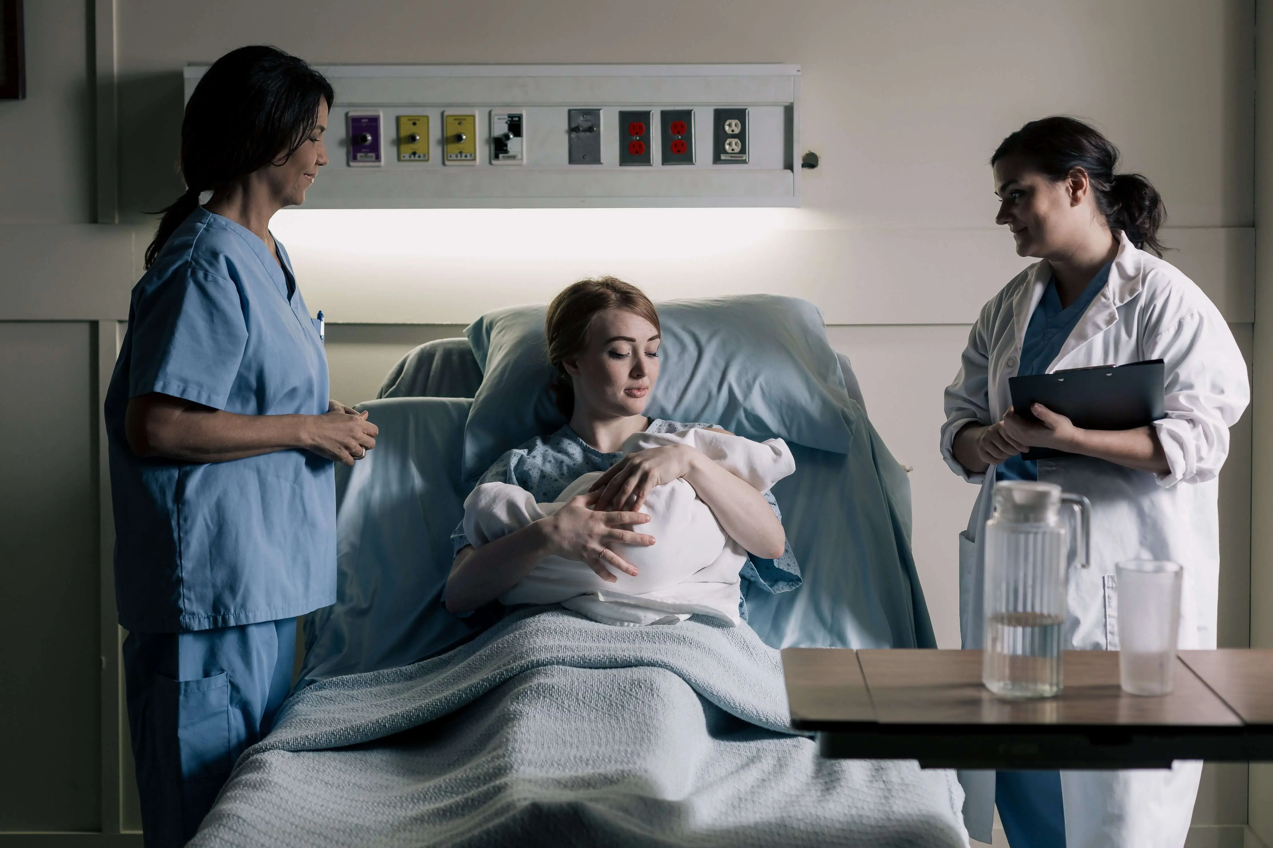 LVN and Doctor with Mother and Her Newborn Baby in the Hospital