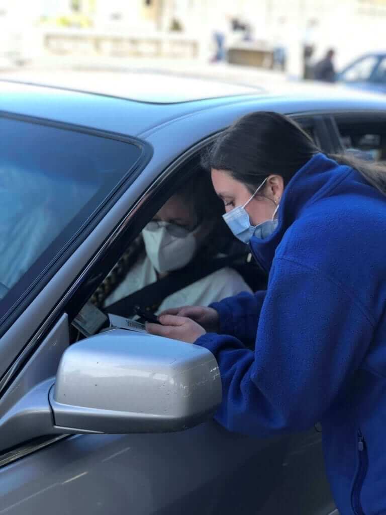 BSN Student Assists with COVID-19 Vaccines at Patient's Car