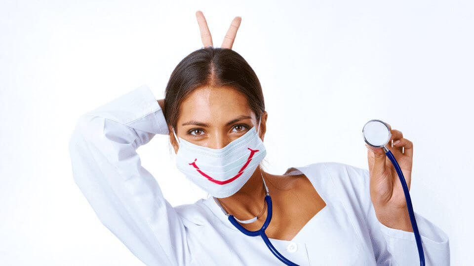A Young Nurse is wearing a Mask with a Smile